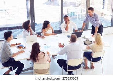 Businessman presenting to colleagues at a meeting