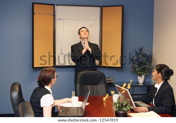 Businessman Presenting His Colleagues Staring Ceiling Stock