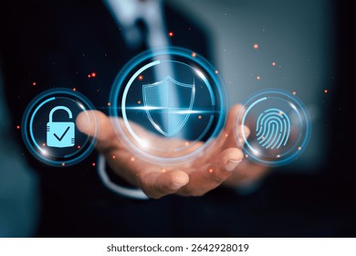 Businessman presenting holographic icons of fingerprint, shield, and lock, symbolizing cybersecurity, data protection, and secure authentication.