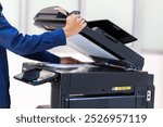 Businessman press button on panel of printer photocopier  network , Working on photocopies in the office concept , printer is office worker tool equipment for scanning and copy paper.