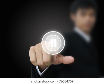 Businessman Press Pause Button