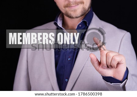 Businessman presses a button with the text MEMBERS ONLY. Business concept.