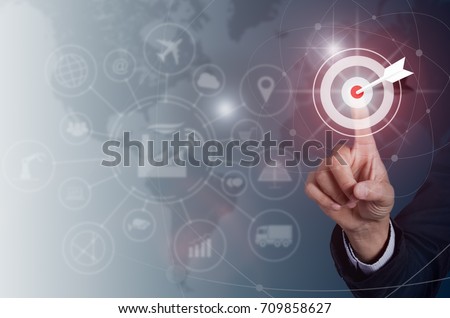 Businessman pressing button goal on virtual screen, Success concept, technology industry  and world maps on the background.