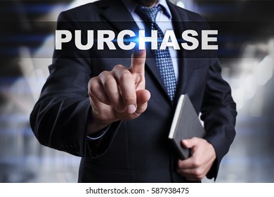 Businessman is pressing button on touch screen interface and selecting purchase. - Shutterstock ID 587938475