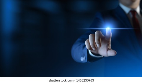 Businessman pressing button on virtual screen. Man pointing on futuristic interface. Space for text