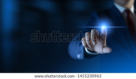 Businessman pressing button on virtual screen. Man pointing on futuristic interface. Space for text