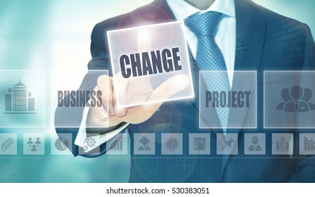 Businessman pressing a Change concept button.