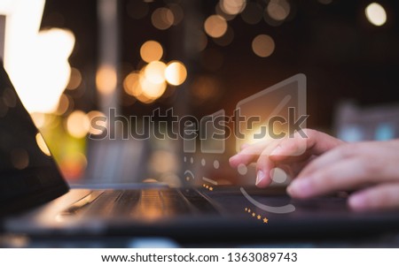 Businessman pressing face emoticon on the keyboard laptop and checklist service report on online shop  / Customer service evaluation concept.