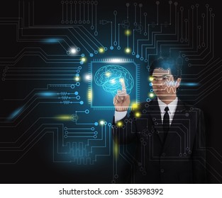 Businessman pressing high tech type of modern buttons on a virtual background