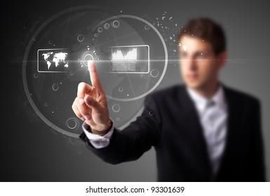 Businessman pressing high tech type of modern buttons on a virtual background - Powered by Shutterstock