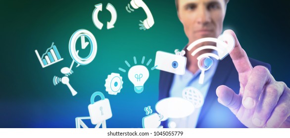 Businessman pressing an invisible virtual screen against green background with vignette - Powered by Shutterstock