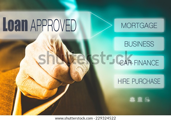Businessman\
pressing a Loan Approved concept\
button.