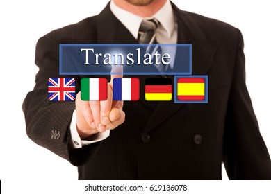 Businessman Pressing On A Virtual Button Translate  To Activate Translate App With National Flags Of Great Britan Italy France Germany And Spain  For English Italian French German Spanish Language 