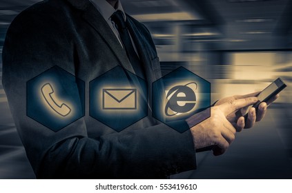 Businessman pressing phone buttons. customer support concept.