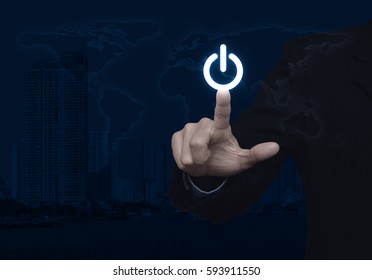 Businessman Pressing Power Button Over World Map And Modern City Tower, Start Up Business Concept, Elements Of This Image Furnished By NASA