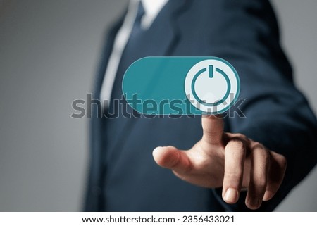 businessman pressing power button. Start or shut down concept.	