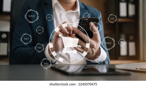 Businessman pressing promotion and delivery modern button at office desk in morning - Shutterstock ID 2245070475