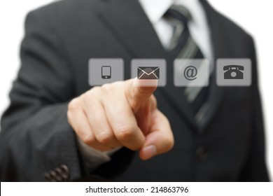 Businessman pressing virtual ( mail,phone,email ) buttons. customer support concept