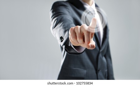 Businessman pressing virtual media type of buttons - Powered by Shutterstock