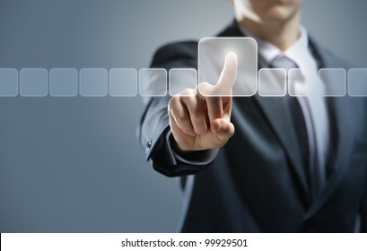 Businessman pressing virtual media type of buttons - Powered by Shutterstock