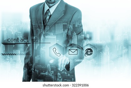 Businessman pressing virtual phone buttons. customer support concept.