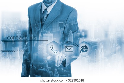 Businessman pressing virtual phone buttons. customer support concept.