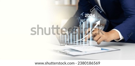 Businessman profit analysis with augmented reality in 2024, 2024 positive indicators profitability and growth in business, businessman financial strategy calculating long term Investments for success. Foto d'archivio © 