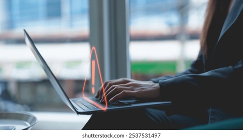 Businessman or programmer, developer using computer laptop with triangle caution warning sign for notification error and maintenance concept. Virus detected warning, Cybercrime protection.	