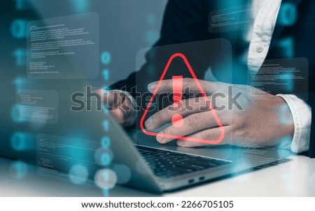 Businessman or programmer using laptop with triangle caution warning sign, coding, cryptography, hacker, crime, virus, for notification error and maintenance concept.