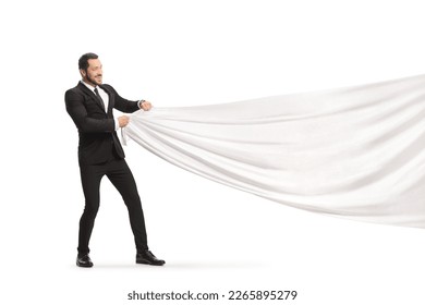 Businessman pulling a big white cloth isolated on white background - Shutterstock ID 2265895279