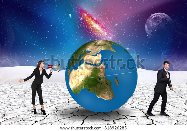 Businessman pulls world sphere in\
cosmos desert .Elements of this image furnished by\
NASA