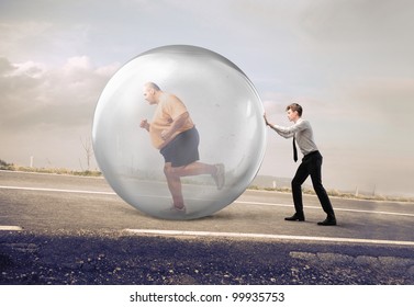 Businessman pushing a bubble with fat man running in it