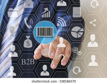 Businessman pushing button with the icon of the barcode on the touch screen