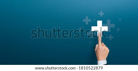 Businessman pushing button positive thing. Business for Profit, Benefit, health insurance, Development and growth concepts. Represented by a plus sign with copy space