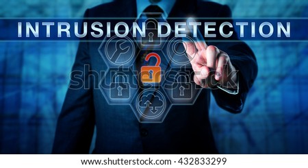 Businessman is pushing INTRUSION DETECTION on an interactive control screen. Cyber security concept and information technology metaphor for software tools scanning for the latest malware threats.