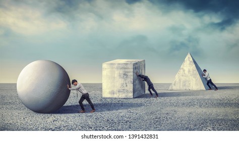 Businessman pushing the round large stone. Business heavy tasks and problems concept. differentiation between work - Shutterstock ID 1391432831