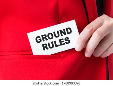 Businessman Putting A Card With Text Ground Rules In The Pocket