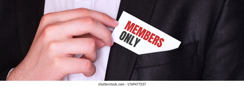 Businessman Putting A Card With Text MEMBERS ONLY In The Pocket