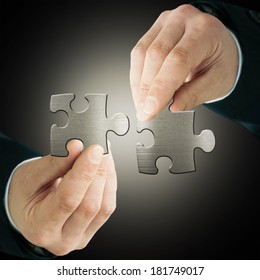 Businessman with  puzzles - Shutterstock ID 181749017