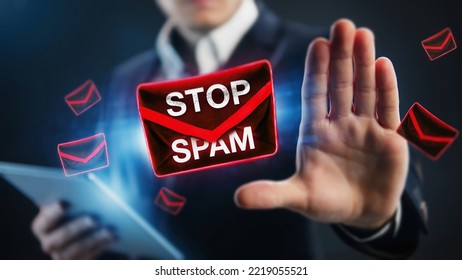 Businessman raised his palm as a stop spam sign. Stop email spam concept