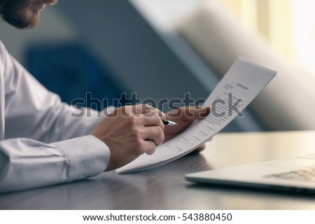 Businessman reading documents