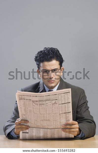 Businessman Reading Financial Newspaper Stock Photo (Edit Now) 155693282