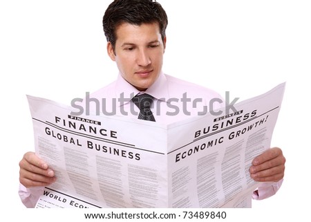 A businessman reading a newspaper