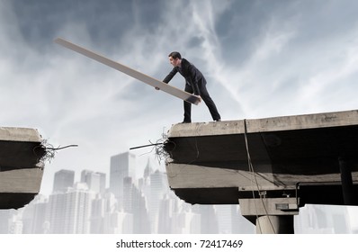 Businessman Rebuilding A Broken Bridge