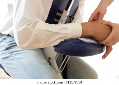 Businessman Receiving Shiatsu On A Quick Massage Chair