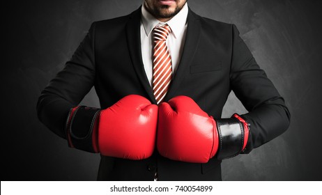 businessman with red boxing gloves - Powered by Shutterstock