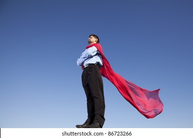 Businessman With A Red Flying Cape Like Superman