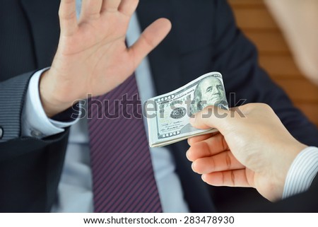 Businessman refusing money - anti bribery and corruption concepts