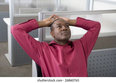 Businessman Relaxing In Office Cubicle