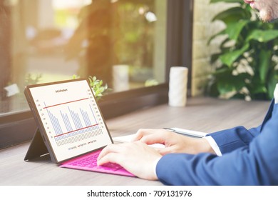 Businessman Review  Financial Report From Sales Team, Planing To Promote Products Into Market And Analyze Data To Support His Decision Maker - Business Concept